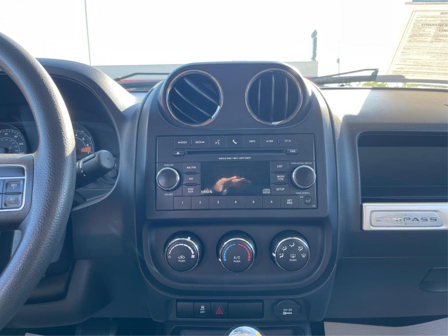 2016 Black Jeep Compass Sport FWD (1C4NJCBA0GD) with an 2.0L L4 DOHC 16V engine, located at 401 Woodman Dr, Riverside, OH, 45431, (937) 908-9800, 39.760899, -84.123421 - Photo#10