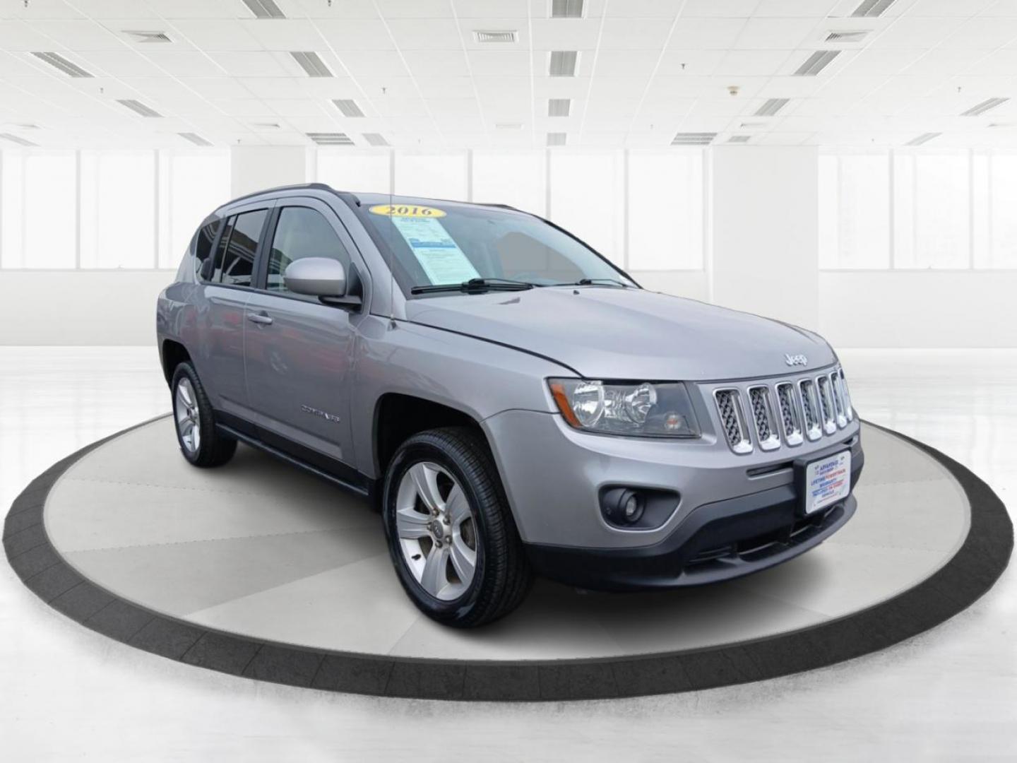 2016 Silver Jeep Compass Latitude 4WD (1C4NJDEB5GD) with an 2.4L L4 DOHC 16V engine, 6A transmission, located at 401 Woodman Dr, Riverside, OH, 45431, (937) 908-9800, 39.760899, -84.123421 - Photo#0