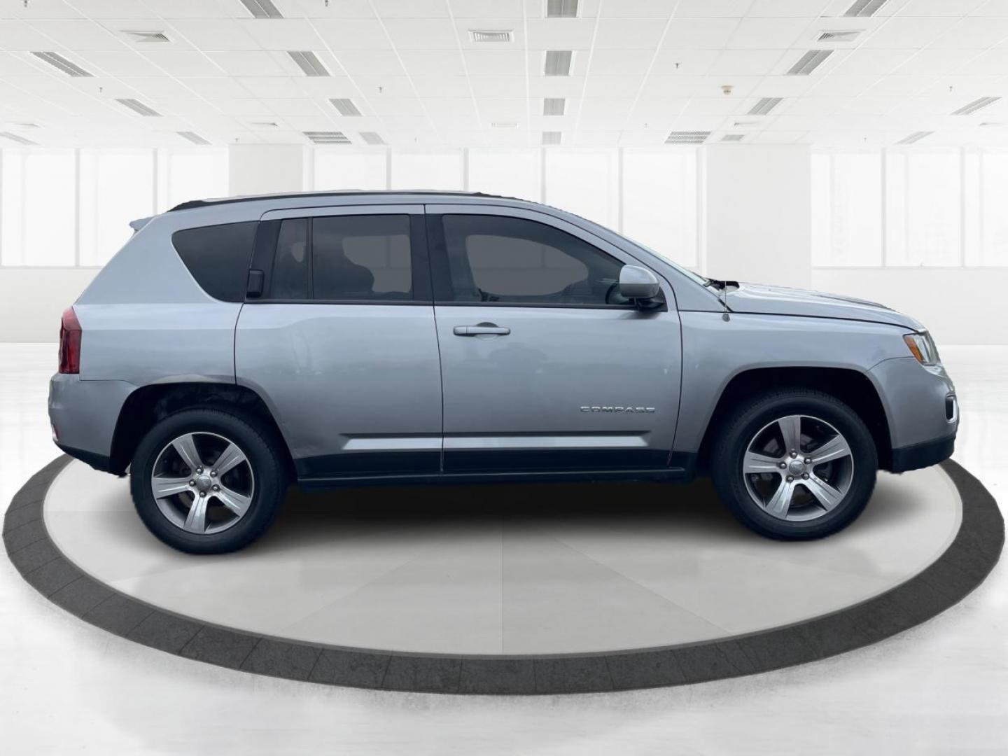 2016 Silver Jeep Compass (1C4NJDEB3GD) with an 2.4L L4 DOHC 16V engine, 6-Speed Automatic transmission, located at 880 E. National Road, Vandalia, OH, 45377, (937) 908-9800, 39.891918, -84.183594 - Photo#1