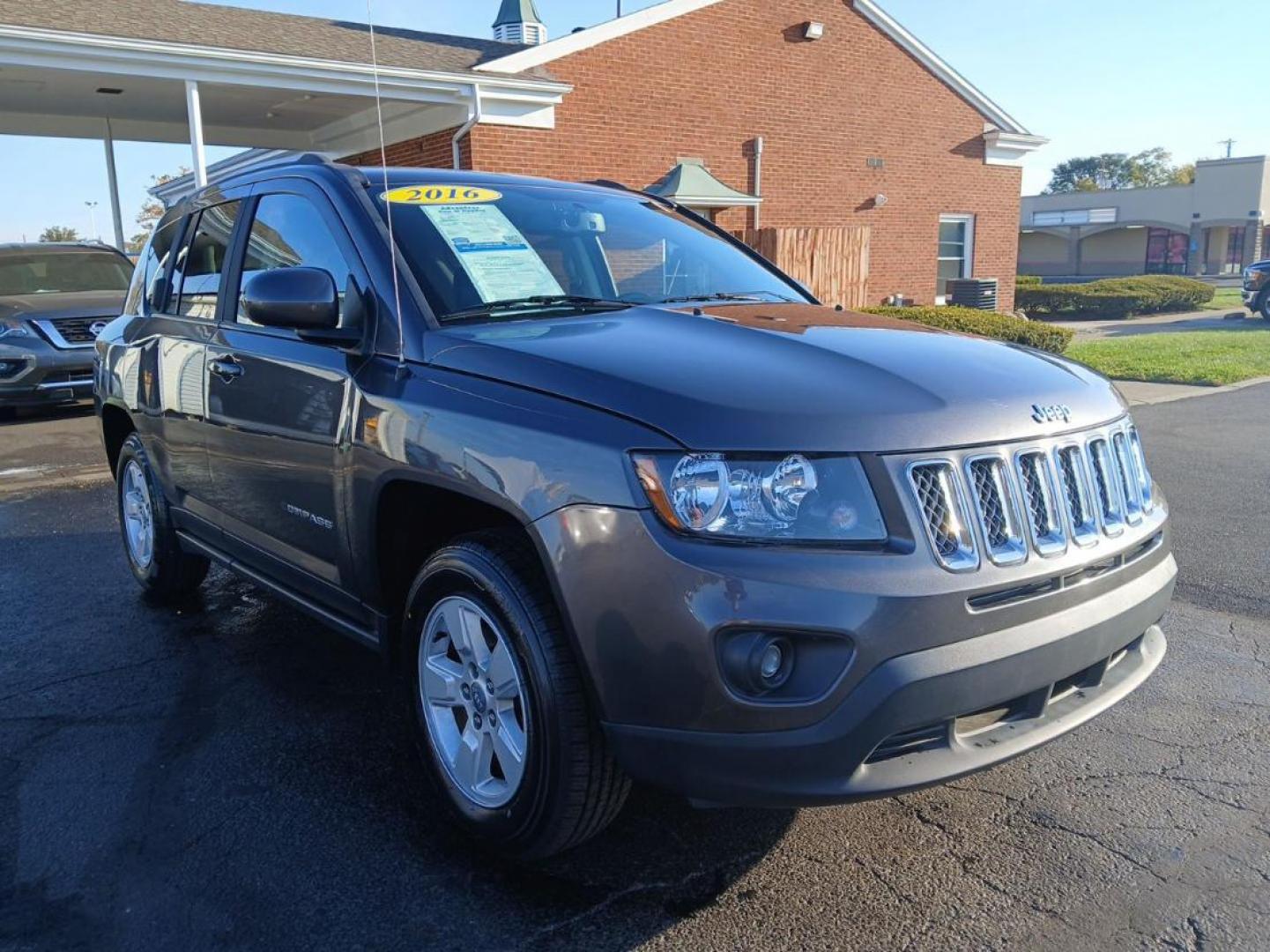 2016 Gray Jeep Compass Latitude FWD (1C4NJCEB4GD) with an 2.4L L4 DOHC 16V engine, CVT transmission, located at 880 E. National Road, Vandalia, OH, 45377, (937) 908-9800, 39.891918, -84.183594 - Photo#0