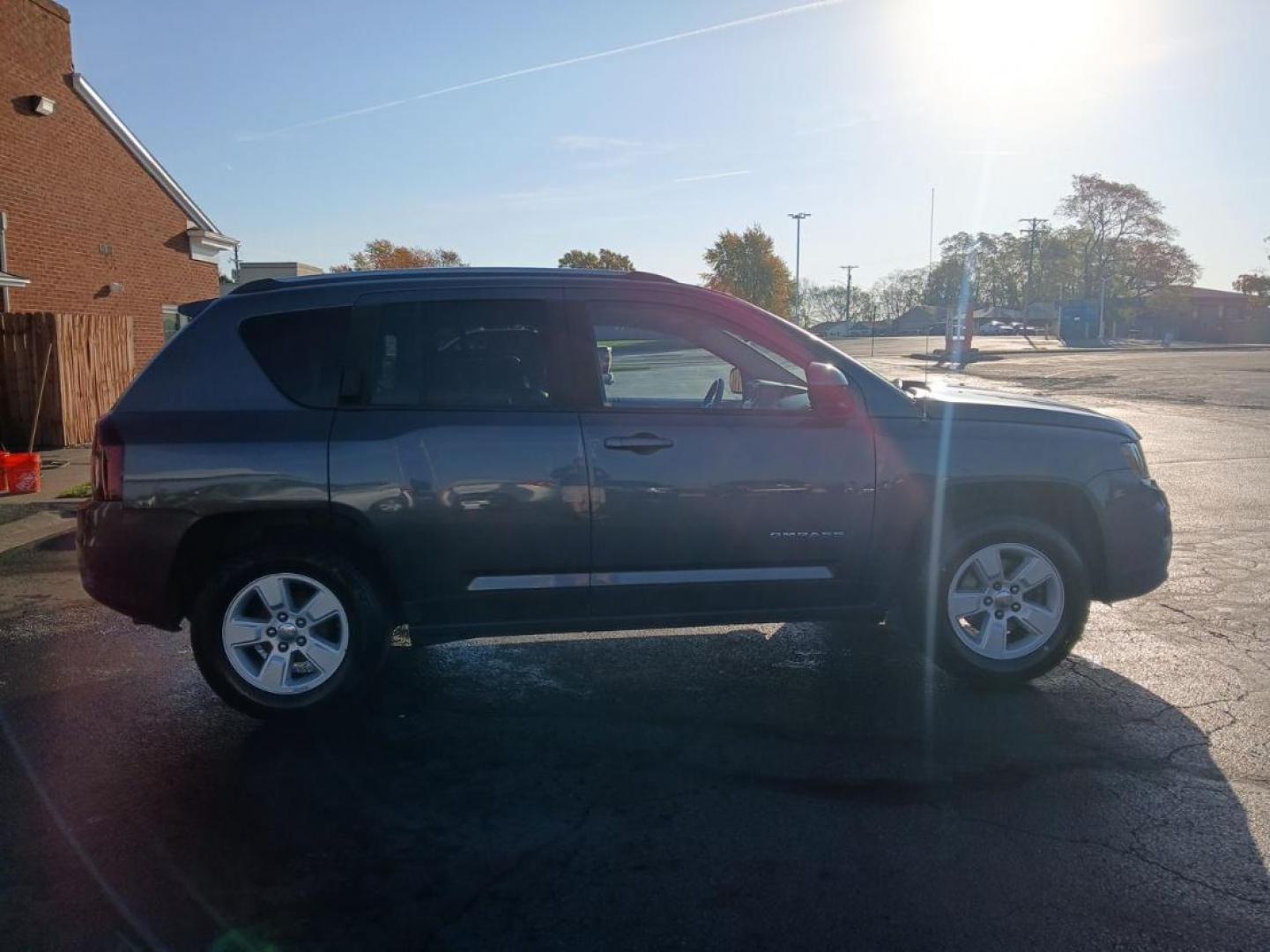 2016 Gray Jeep Compass Latitude FWD (1C4NJCEB4GD) with an 2.4L L4 DOHC 16V engine, CVT transmission, located at 880 E. National Road, Vandalia, OH, 45377, (937) 908-9800, 39.891918, -84.183594 - Photo#1