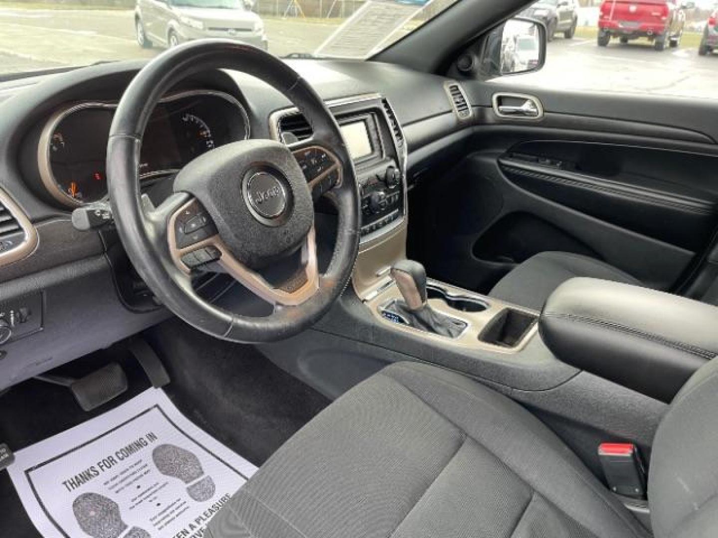 2016 Brilliant Black Crystal Pearl Coat Jeep Grand Cherokee Laredo 4WD (1C4RJFAG0GC) with an 3.6L V6 DOHC 24V engine, 8-Speed Automatic transmission, located at 1230 East Main St, Xenia, OH, 45385, (937) 908-9800, 39.688026, -83.910172 - Photo#6