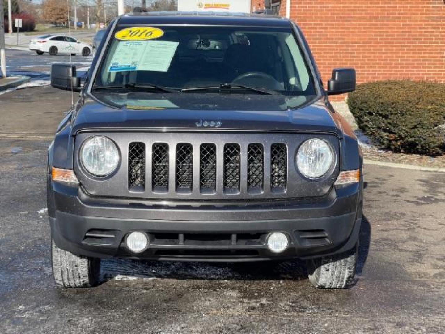 2016 Gray Jeep Patriot Latitude 4WD (1C4NJRFBXGD) with an 2.4L L4 DOHC 16V engine, located at 4508 South Dixie Dr, Moraine, OH, 45439, (937) 908-9800, 39.689976, -84.218452 - Photo#5