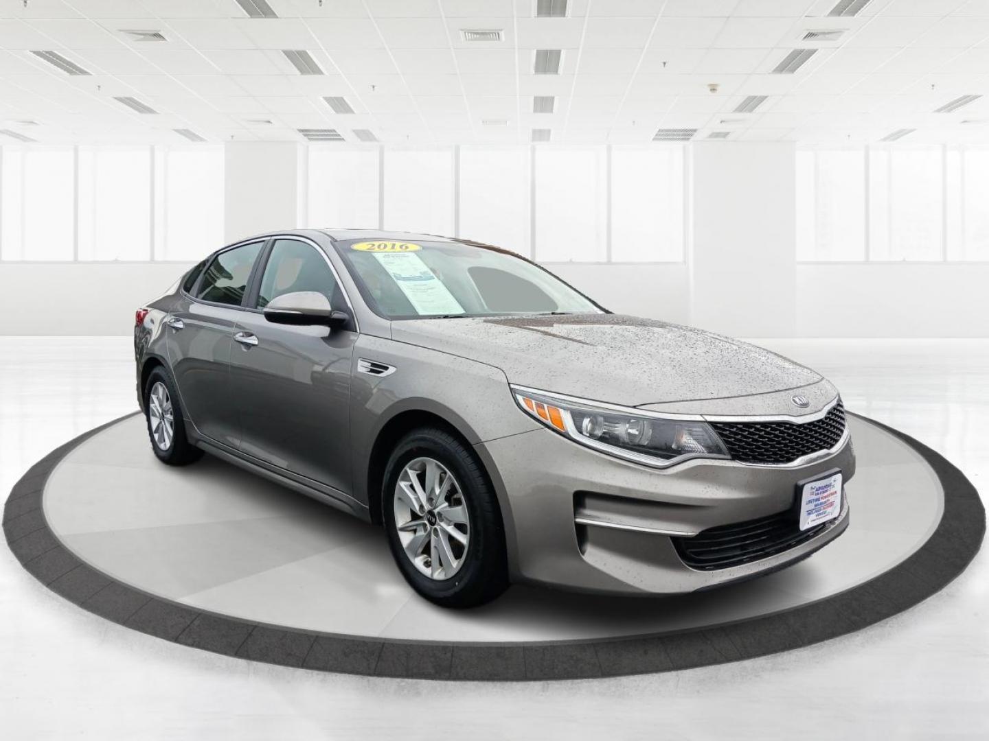 2016 Moss Grey Kia Optima LX (5XXGT4L34GG) with an 2.4L L4 DOHC 16V engine, 6-Speed Automatic transmission, located at 880 E. National Road, Vandalia, OH, 45377, (937) 908-9800, 39.891918, -84.183594 - Photo#0