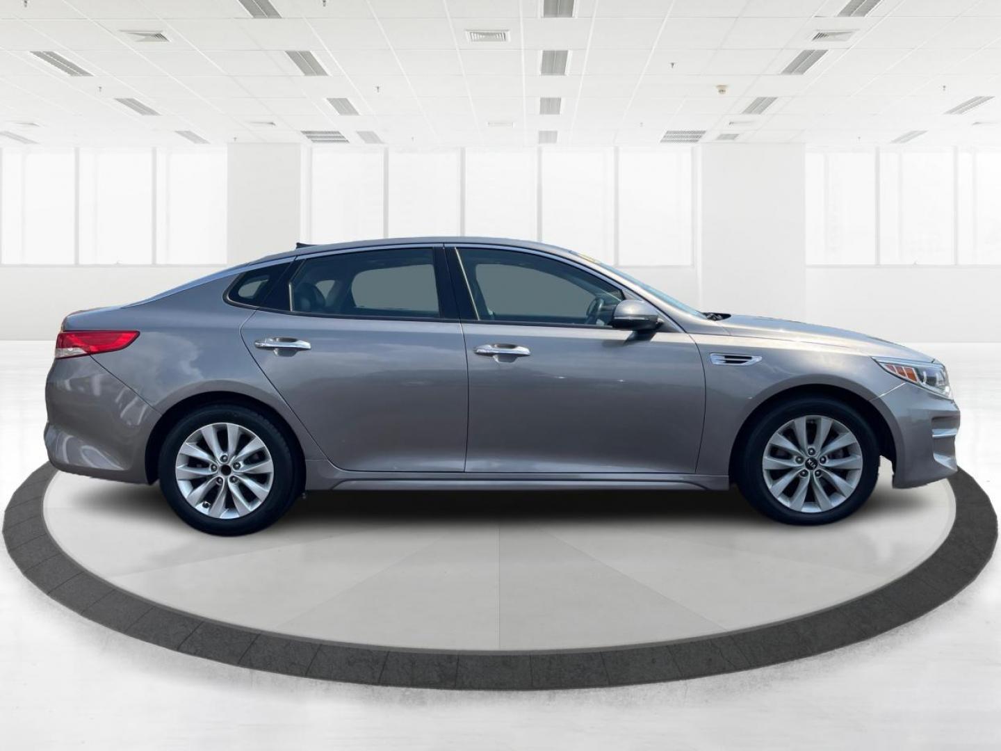 2016 Moss Grey Kia Optima EX (5XXGU4L38GG) with an 2.4L L4 DOHC 16V engine, 6A transmission, located at 880 E. National Road, Vandalia, OH, 45377, (937) 908-9800, 39.891918, -84.183594 - Photo#1