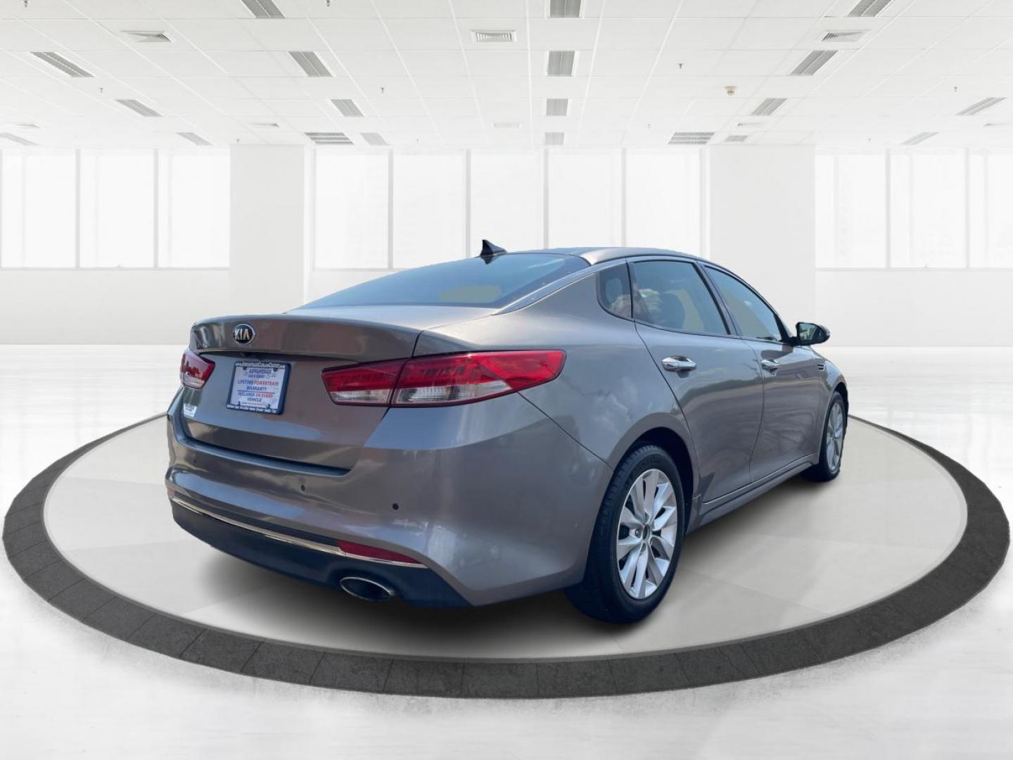 2016 Moss Grey Kia Optima EX (5XXGU4L38GG) with an 2.4L L4 DOHC 16V engine, 6A transmission, located at 880 E. National Road, Vandalia, OH, 45377, (937) 908-9800, 39.891918, -84.183594 - Photo#2