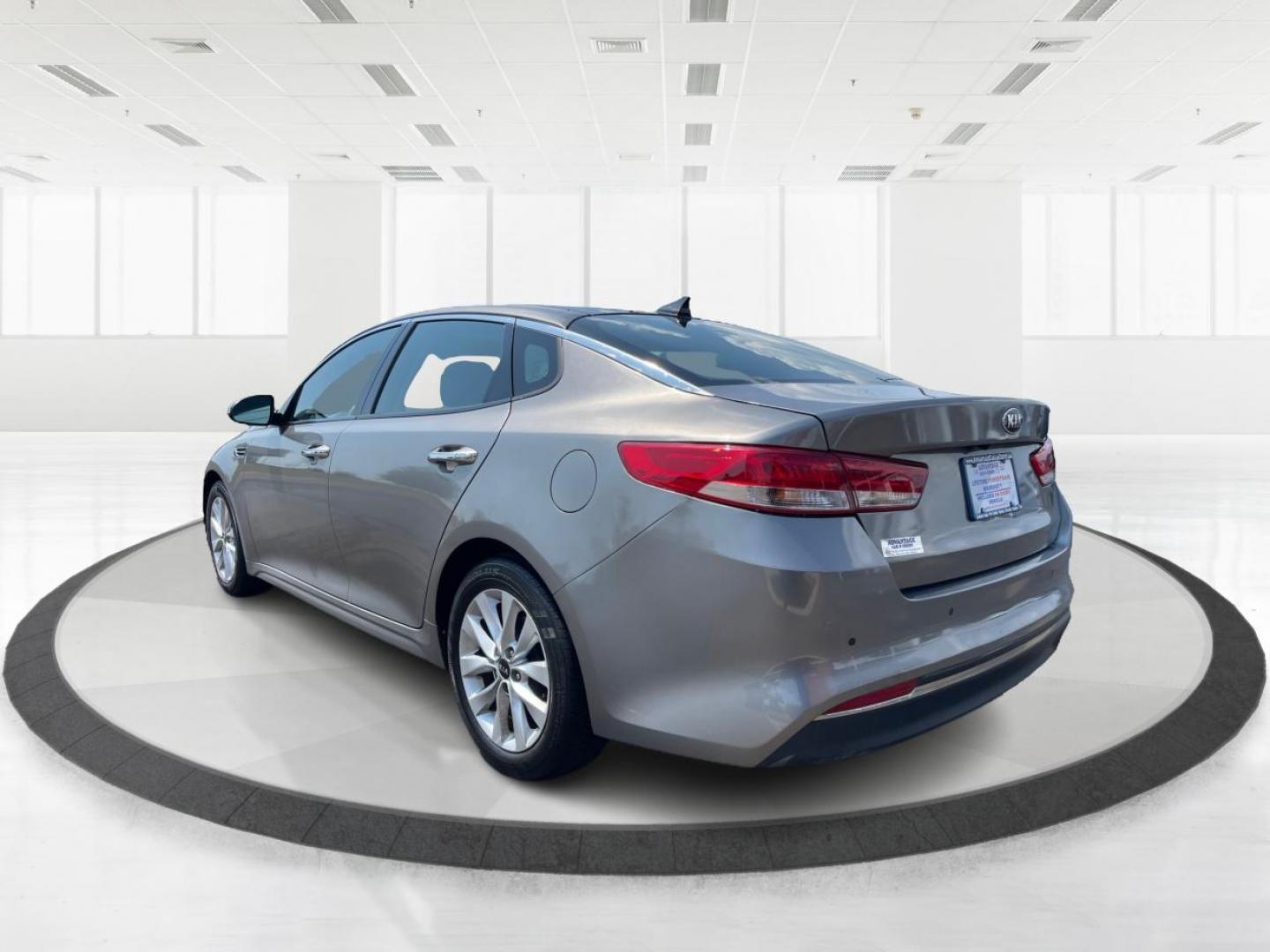 2016 Moss Grey Kia Optima EX (5XXGU4L38GG) with an 2.4L L4 DOHC 16V engine, 6A transmission, located at 880 E. National Road, Vandalia, OH, 45377, (937) 908-9800, 39.891918, -84.183594 - Photo#4