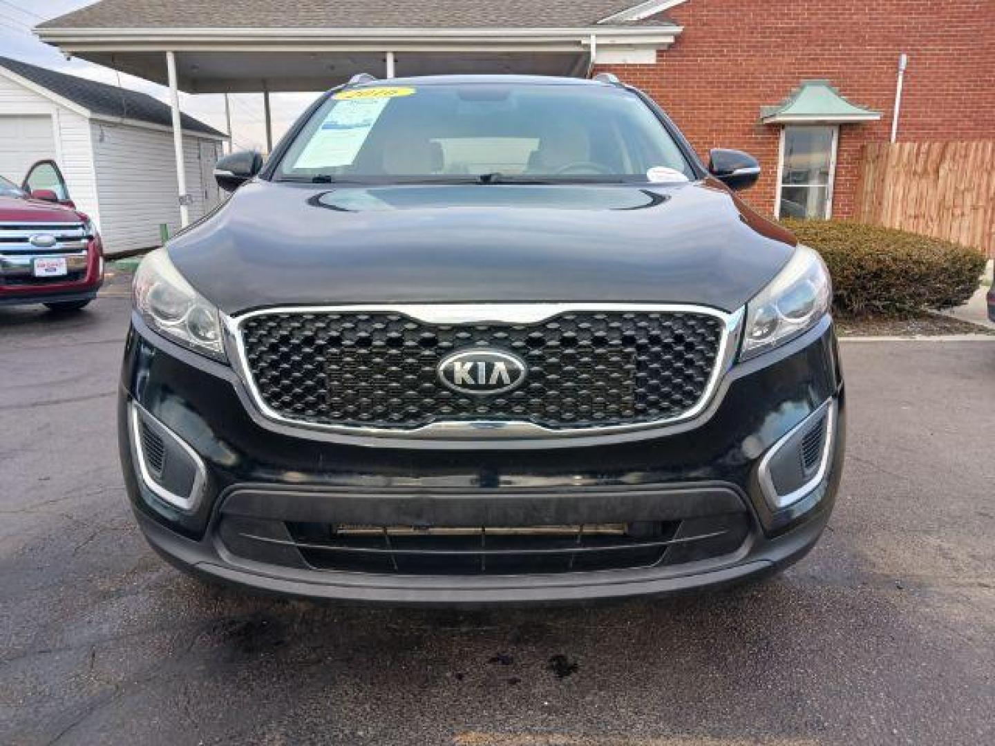 2016 Ebony Black Kia Sorento LX 2WD (5XYPG4A34GG) with an 2.4L L4 DOHC 16V engine, 6-Speed Automatic transmission, located at 880 E. National Road, Vandalia, OH, 45377, (937) 908-9800, 39.891918, -84.183594 - Photo#1