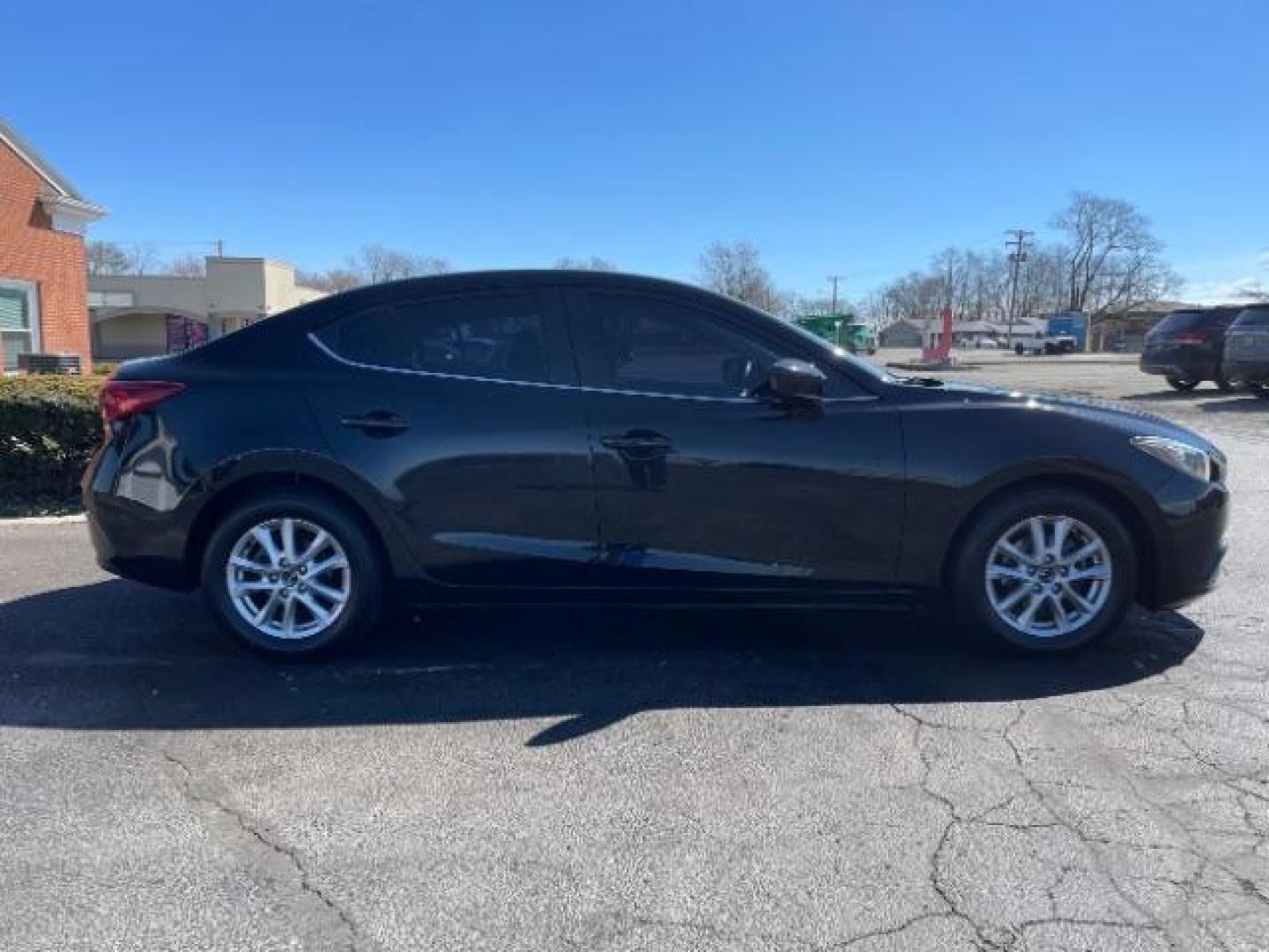 2016 Jet Black Mica Mazda MAZDA3 i Sport AT 4-Door (JM1BM1U73G1) with an 2.0L L4 DOHC 16V engine, 6-Speed Automatic transmission, located at 4508 South Dixie Dr, Moraine, OH, 45439, (937) 908-9800, 39.689976, -84.218452 - Photo#3