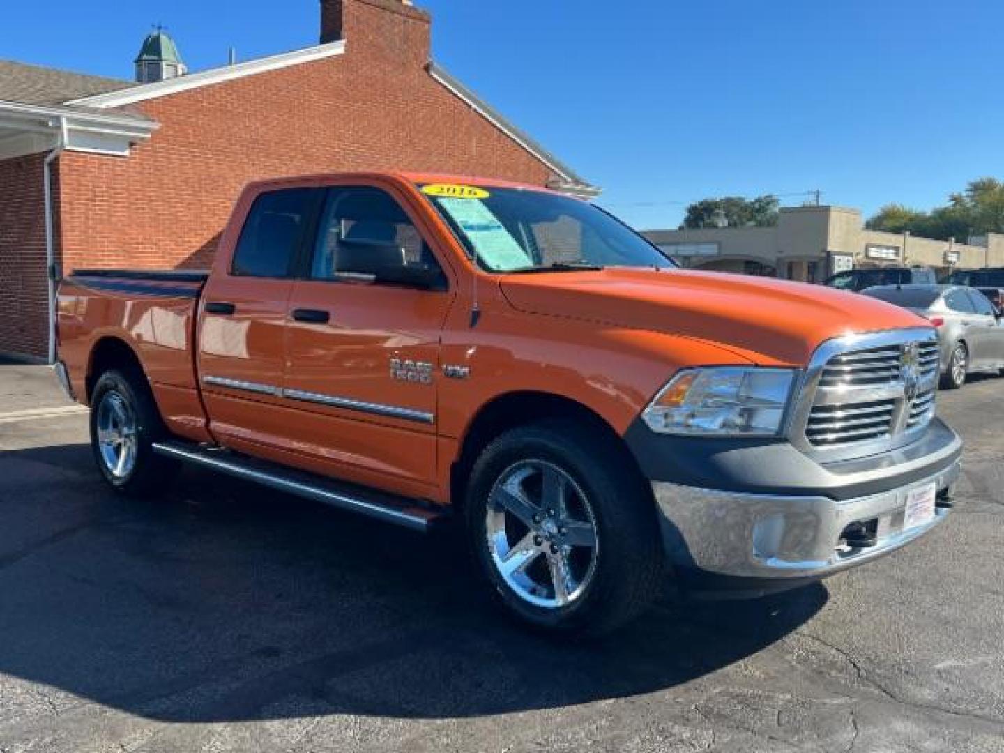 2016 Low Vol Omaha Orange RAM 1500 SLT Quad Cab 4WD (1C6RR7GT3GS) with an 5.7L V8 OHV 16V engine, 8-Speed Automatic transmission, located at 1099 N County Rd 25A , Troy, OH, 45373, (937) 908-9800, 40.057079, -84.212883 - Photo#0