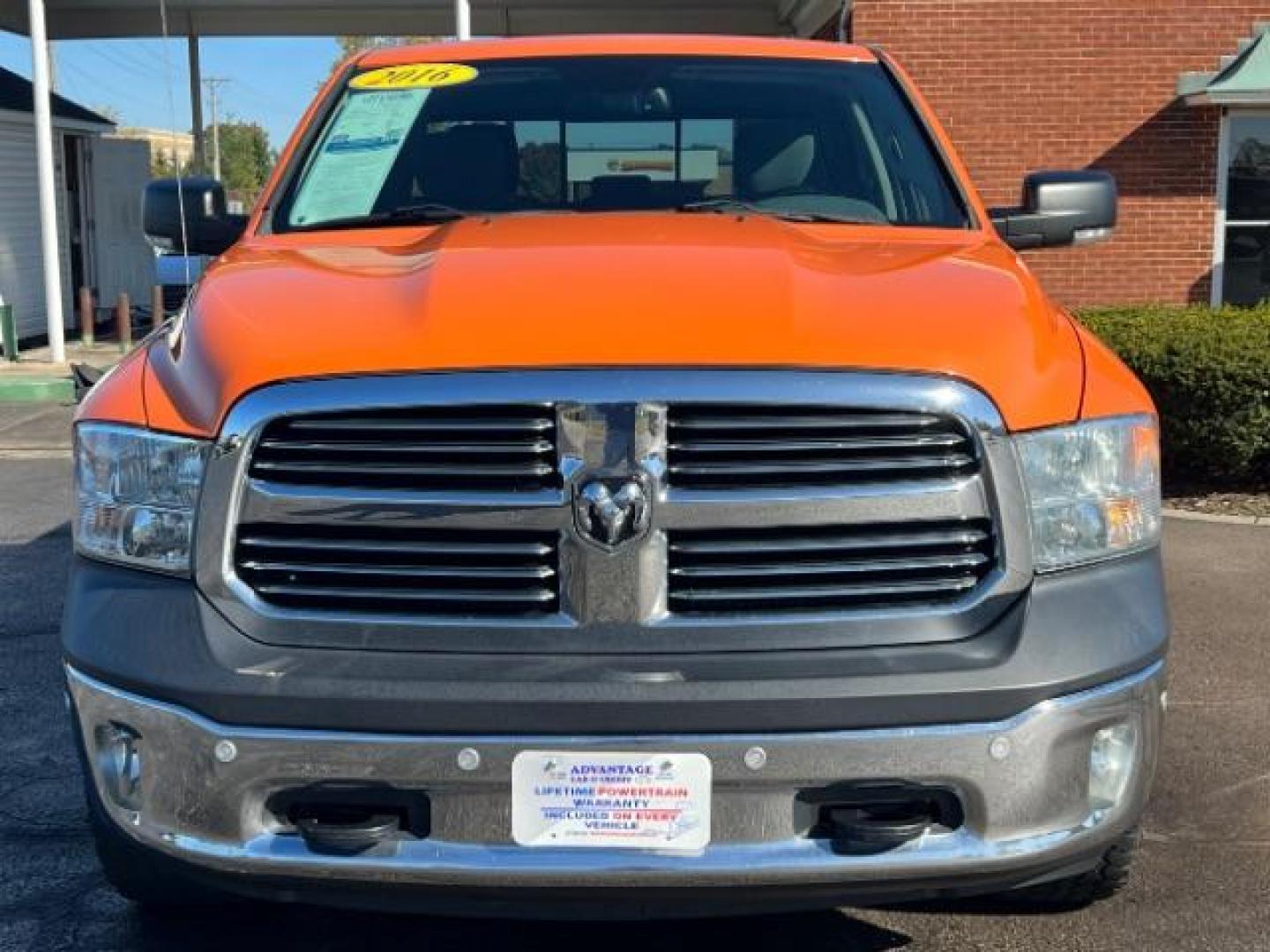 2016 Low Vol Omaha Orange RAM 1500 SLT Quad Cab 4WD (1C6RR7GT3GS) with an 5.7L V8 OHV 16V engine, 8-Speed Automatic transmission, located at 1099 N County Rd 25A , Troy, OH, 45373, (937) 908-9800, 40.057079, -84.212883 - Photo#1