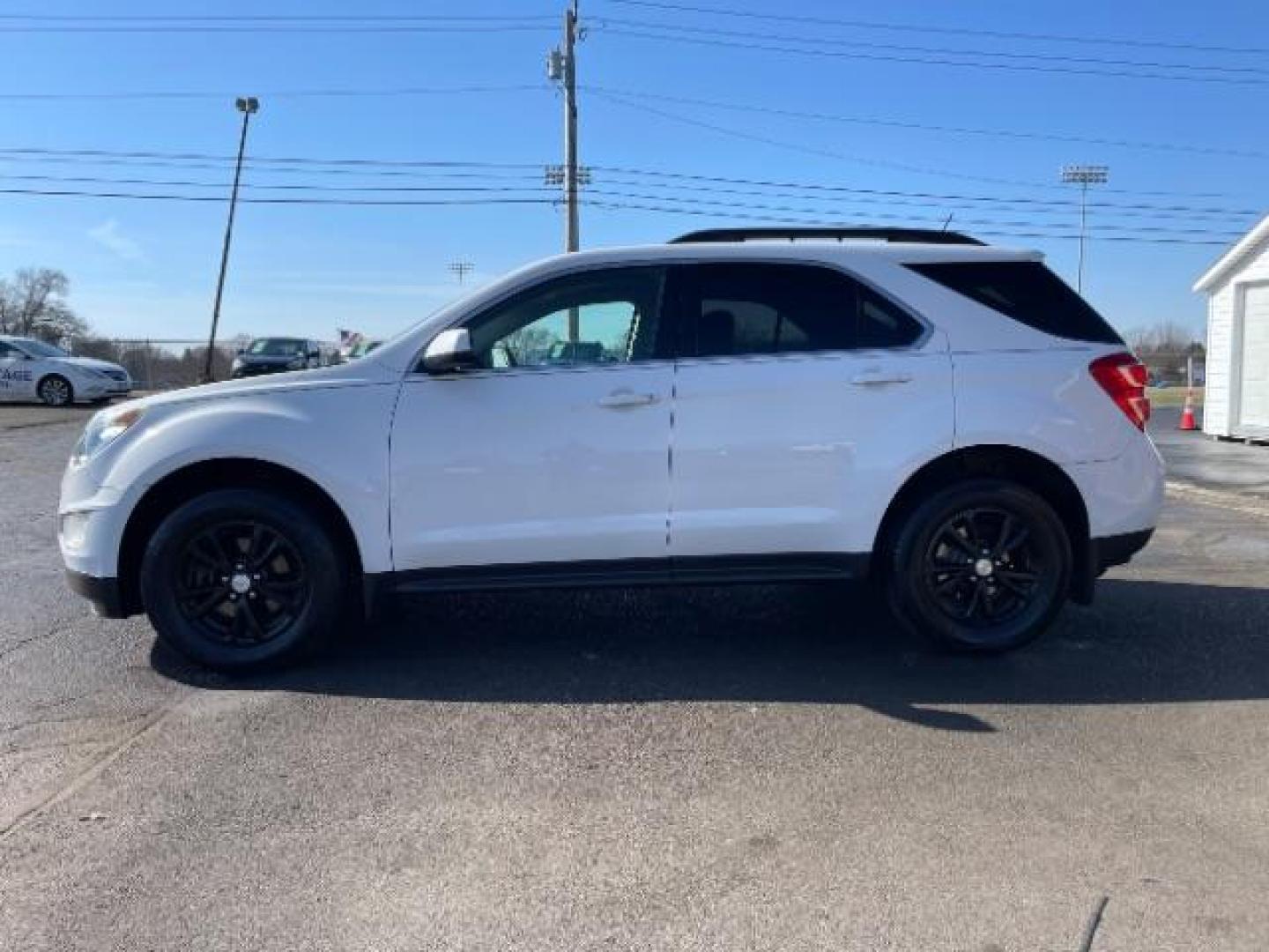 2017 Summit White Chevrolet Equinox LT AWD (2GNFLFEK1H6) with an 2.4L L4 DOHC 16V FFV engine, 6-Speed Automatic transmission, located at 1184 Kauffman Ave, Fairborn, OH, 45324, (937) 908-9800, 39.807072, -84.030914 - Photo#4