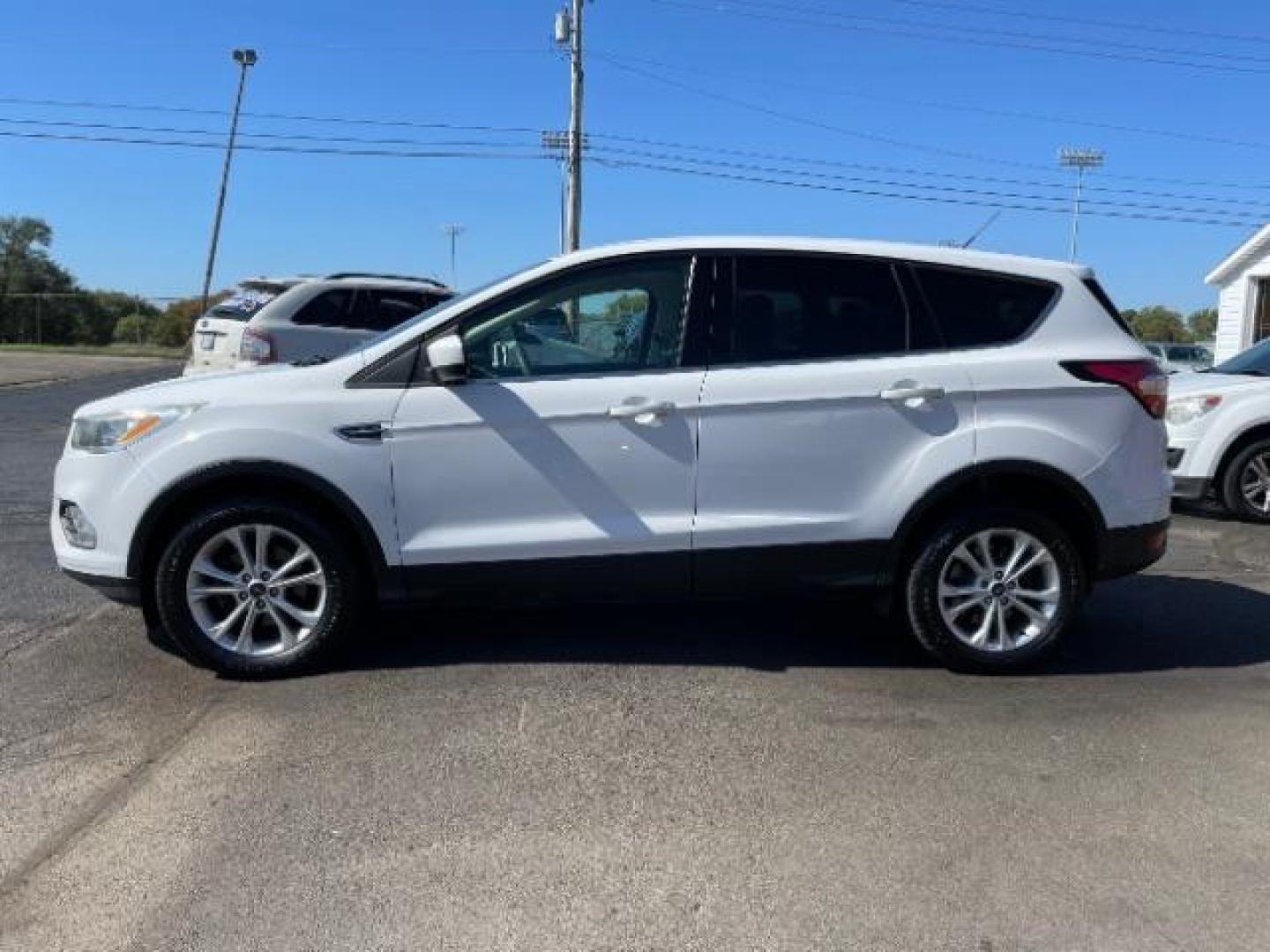 2017 White Platinum Tri-Coat Metallic Ford Escape SE FWD (1FMCU0GD1HU) with an 1.5L L4 DOHC 16V engine, 6-Speed Automatic transmission, located at 4508 South Dixie Dr, Moraine, OH, 45439, (937) 908-9800, 39.689976, -84.218452 - Photo#2