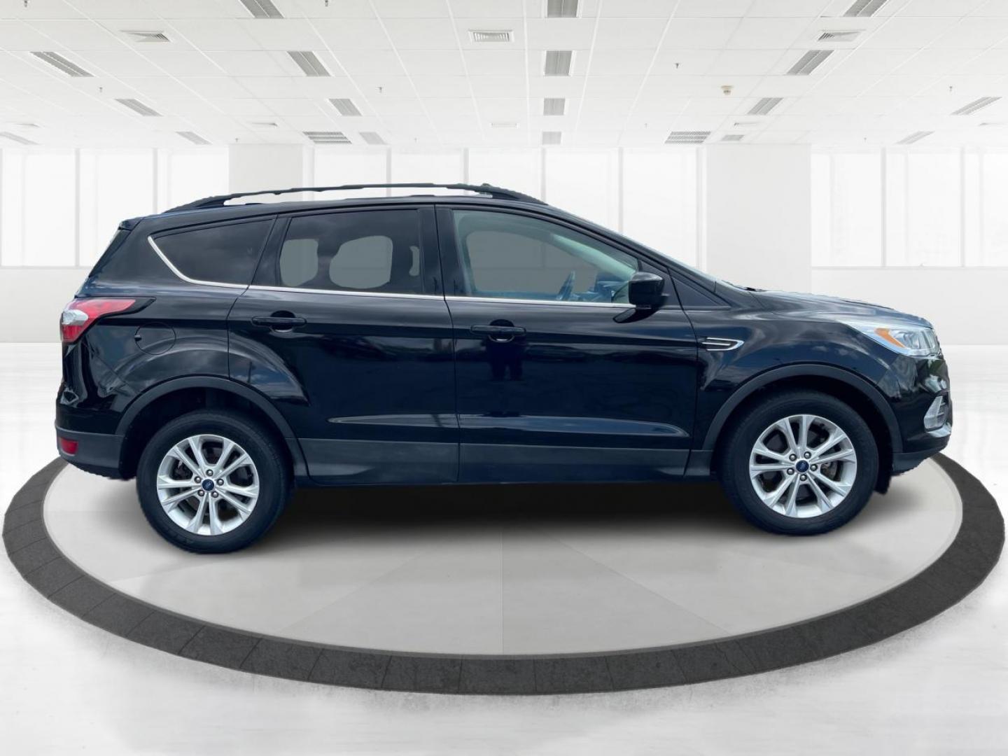 2017 Shadow Black Ford Escape SE 4WD (1FMCU9GD9HU) with an 1.5L L4 DOHC 16V engine, 6A transmission, located at 1230 East Main St, Xenia, OH, 45385, (937) 908-9800, 39.688026, -83.910172 - Photo#1