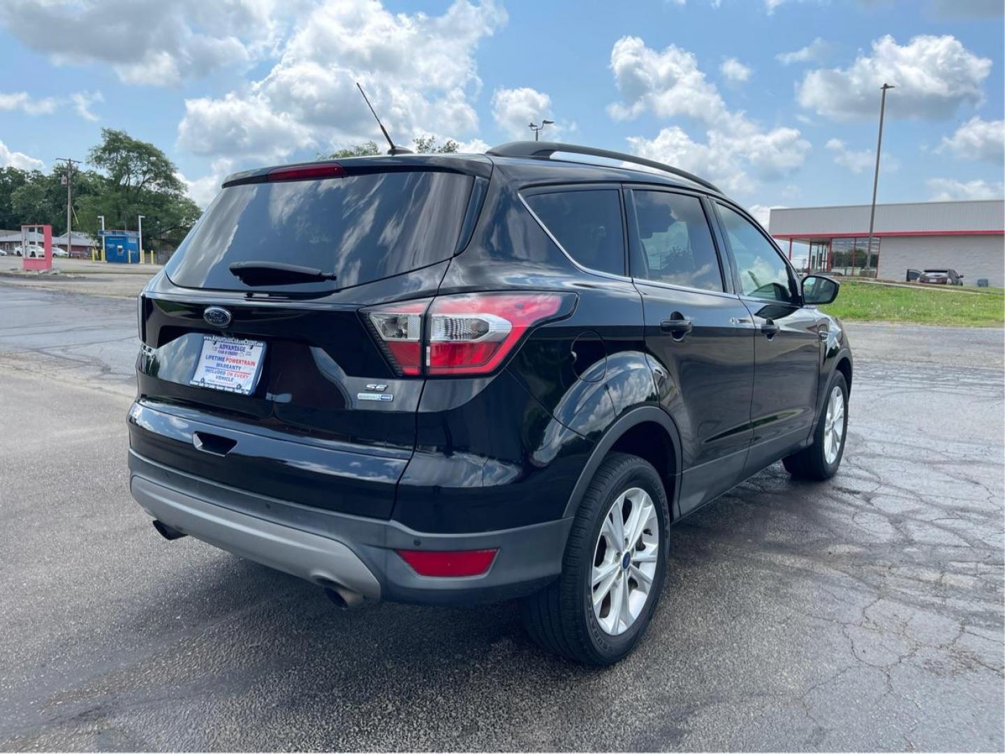 2017 Shadow Black Ford Escape SE 4WD (1FMCU9GD9HU) with an 1.5L L4 DOHC 16V engine, 6A transmission, located at 1230 East Main St, Xenia, OH, 45385, (937) 908-9800, 39.688026, -83.910172 - Photo#2