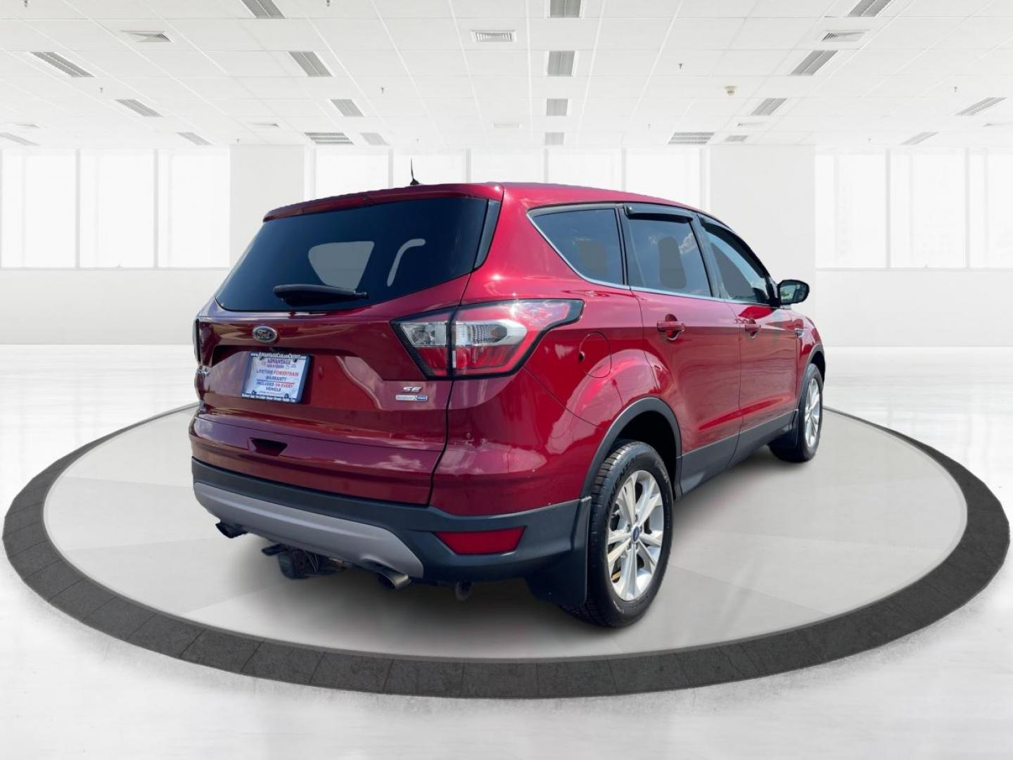 2017 Ruby Red Metallic Tinted Clearcoat Ford Escape (1FMCU9GD0HU) with an 1.5L L4 DOHC 16V engine, 6-Speed Automatic transmission, located at 4508 South Dixie Dr, Moraine, OH, 45439, (937) 908-9800, 39.689976, -84.218452 - Photo#2