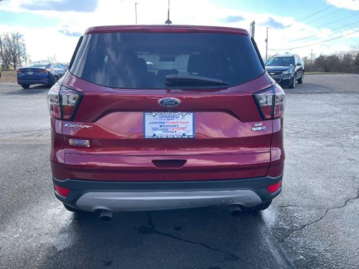 2017 Ruby Red Metallic Tinted Clearcoat Ford Escape SE 4WD (1FMCU9GD4HU) with an 1.5L L4 DOHC 16V engine, 6A transmission, located at 1184 Kauffman Ave, Fairborn, OH, 45324, (937) 908-9800, 39.807072, -84.030914 - Photo#6