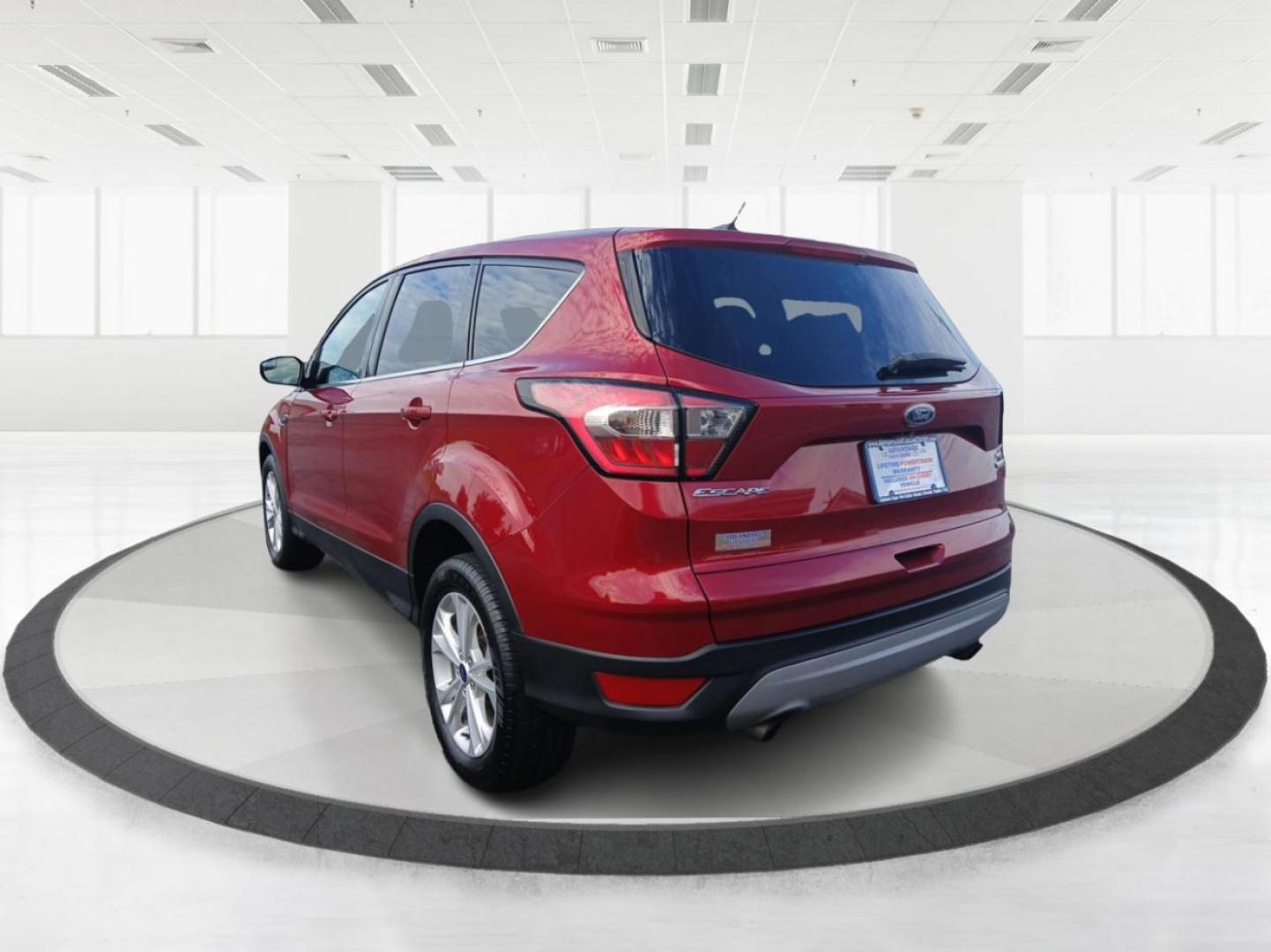 2017 Ruby Red Metallic Tinted Clearcoat Ford Escape (1FMCU9GD0HU) with an 1.5L L4 DOHC 16V engine, 6-Speed Automatic transmission, located at 880 E. National Road, Vandalia, OH, 45377, (937) 908-9800, 39.891918, -84.183594 - Photo#4