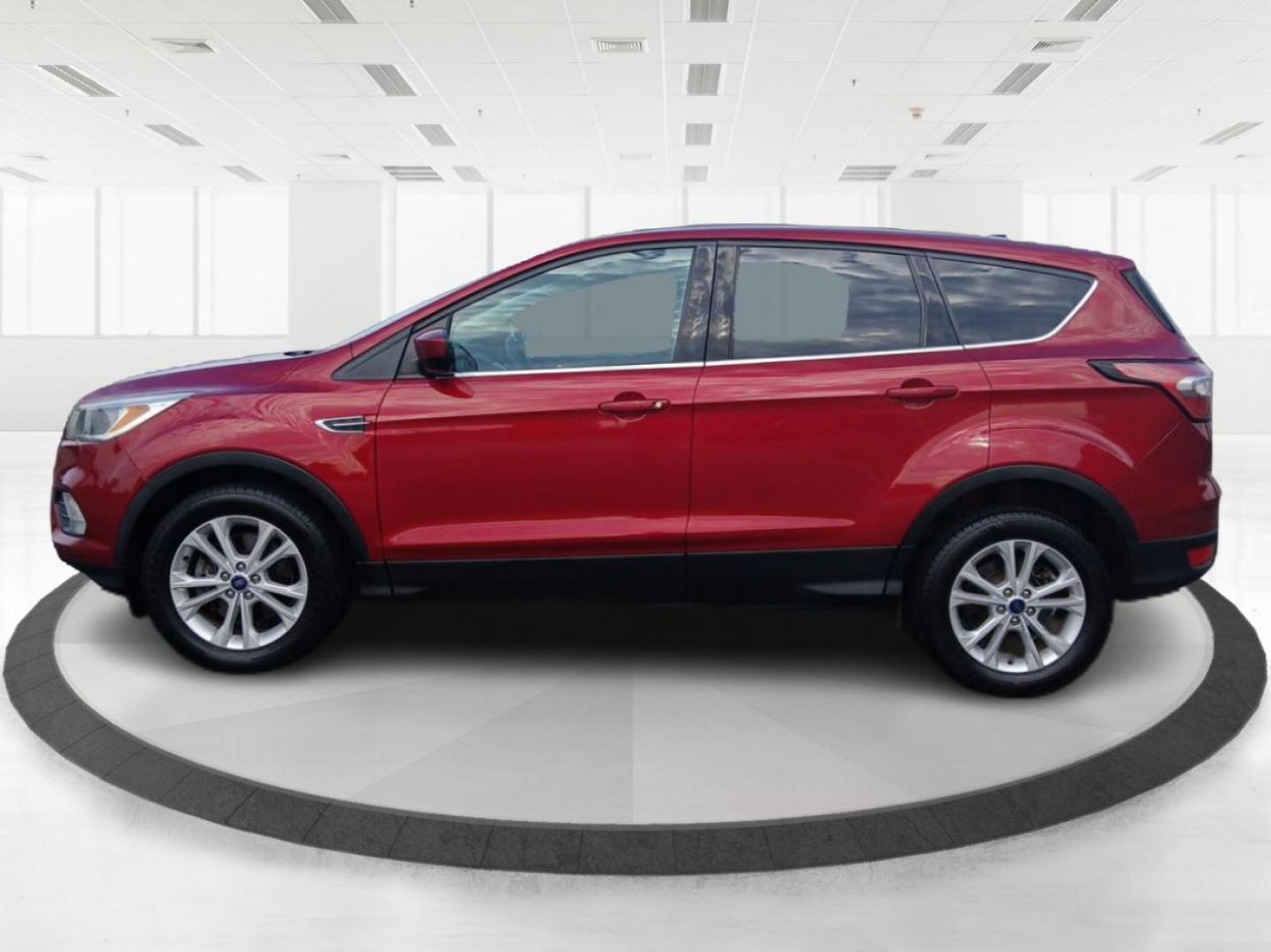 2017 Ruby Red Metallic Tinted Clearcoat Ford Escape (1FMCU9GD0HU) with an 1.5L L4 DOHC 16V engine, 6-Speed Automatic transmission, located at 880 E. National Road, Vandalia, OH, 45377, (937) 908-9800, 39.891918, -84.183594 - Photo#5