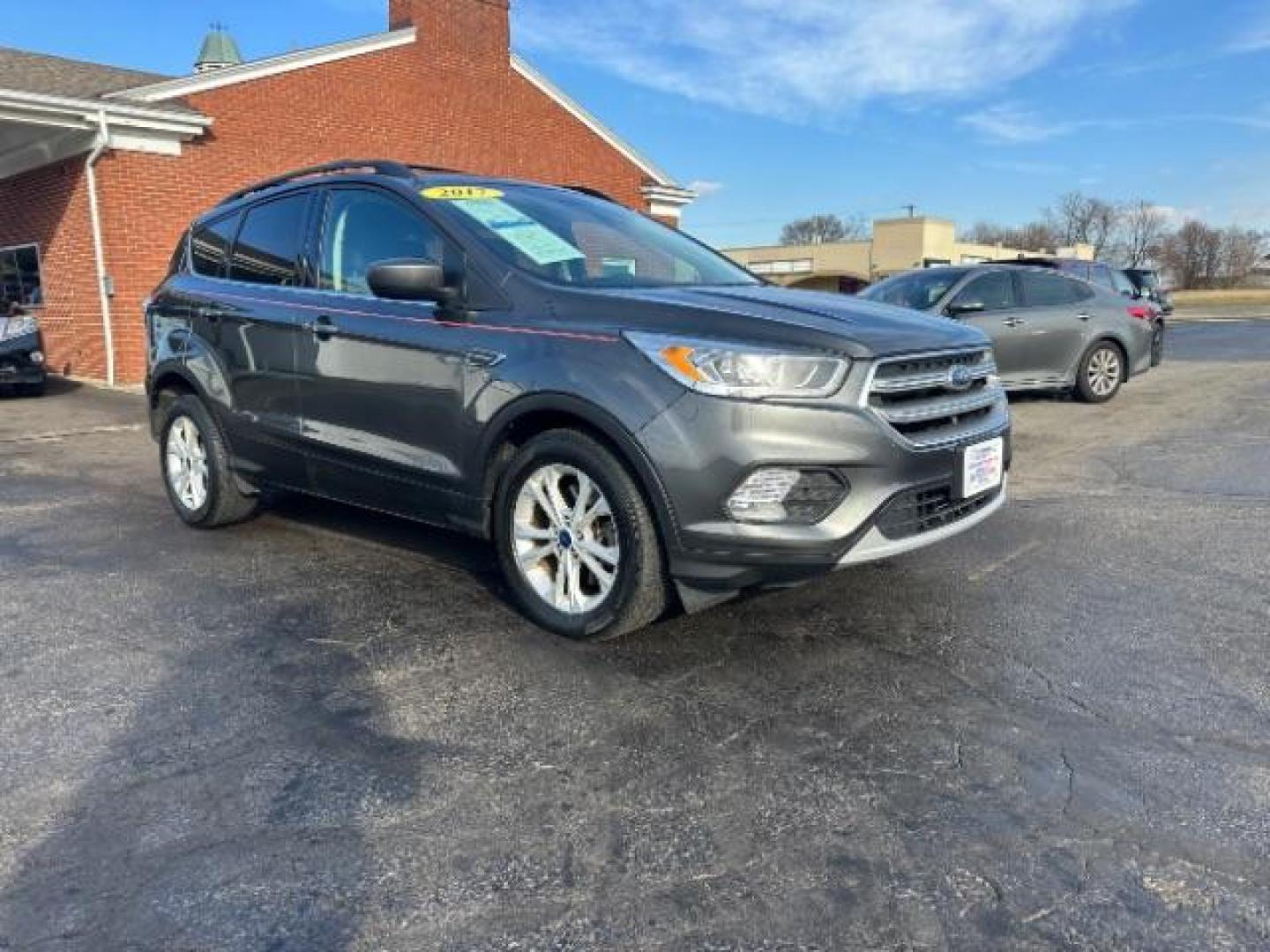 2017 Magnetic Metallic Ford Escape SE 4WD (1FMCU9G91HU) with an 2.0L L4 DOHC 16V engine, 6-Speed Automatic transmission, located at 1951 S Dayton Lakeview Rd., New Carlisle, OH, 45344, (937) 908-9800, 39.890999, -84.050255 - Photo#0