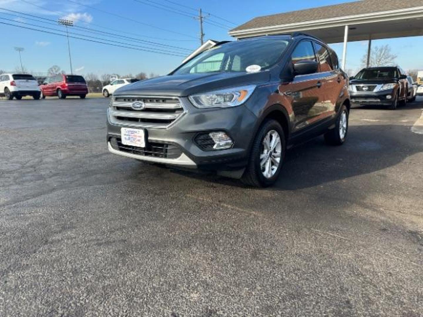 2017 Magnetic Metallic Ford Escape SE 4WD (1FMCU9G91HU) with an 2.0L L4 DOHC 16V engine, 6-Speed Automatic transmission, located at 1951 S Dayton Lakeview Rd., New Carlisle, OH, 45344, (937) 908-9800, 39.890999, -84.050255 - Photo#2