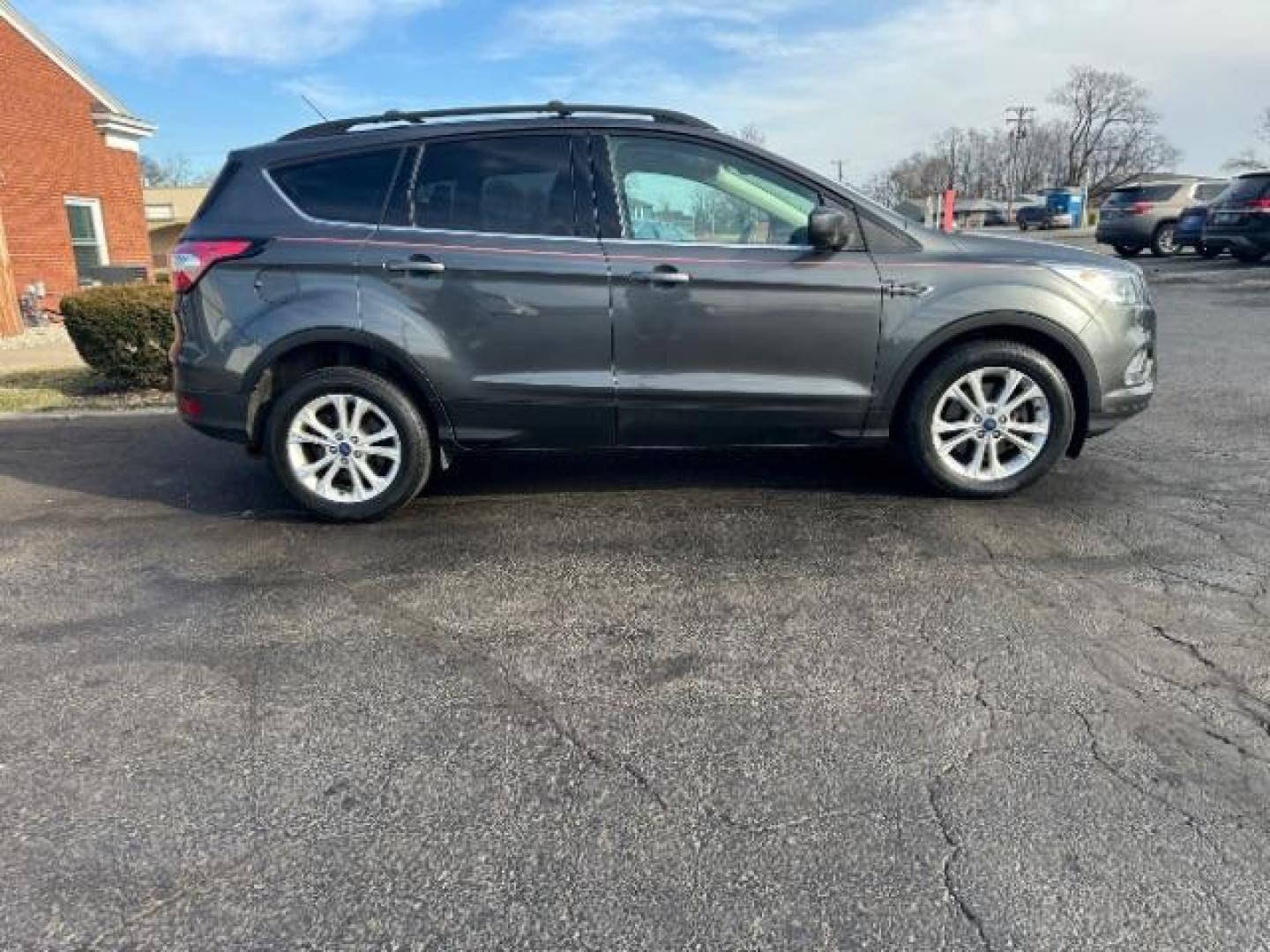 2017 Magnetic Metallic Ford Escape SE 4WD (1FMCU9G91HU) with an 2.0L L4 DOHC 16V engine, 6-Speed Automatic transmission, located at 1951 S Dayton Lakeview Rd., New Carlisle, OH, 45344, (937) 908-9800, 39.890999, -84.050255 - Photo#5