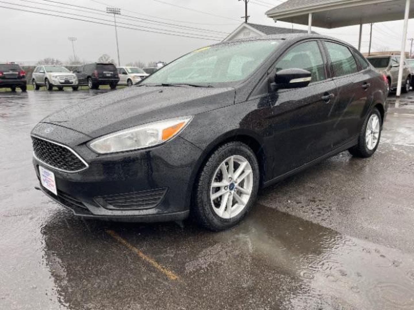 2017 Shadow Black Ford Focus SE Sedan (1FADP3F23HL) with an 2.0L L4 DOHC 16V engine, located at 1099 N County Rd 25A , Troy, OH, 45373, (937) 908-9800, 40.057079, -84.212883 - Photo#1