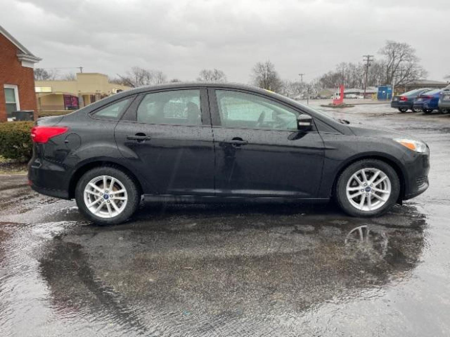 2017 Shadow Black Ford Focus SE Sedan (1FADP3F23HL) with an 2.0L L4 DOHC 16V engine, located at 1099 N County Rd 25A , Troy, OH, 45373, (937) 908-9800, 40.057079, -84.212883 - Photo#5