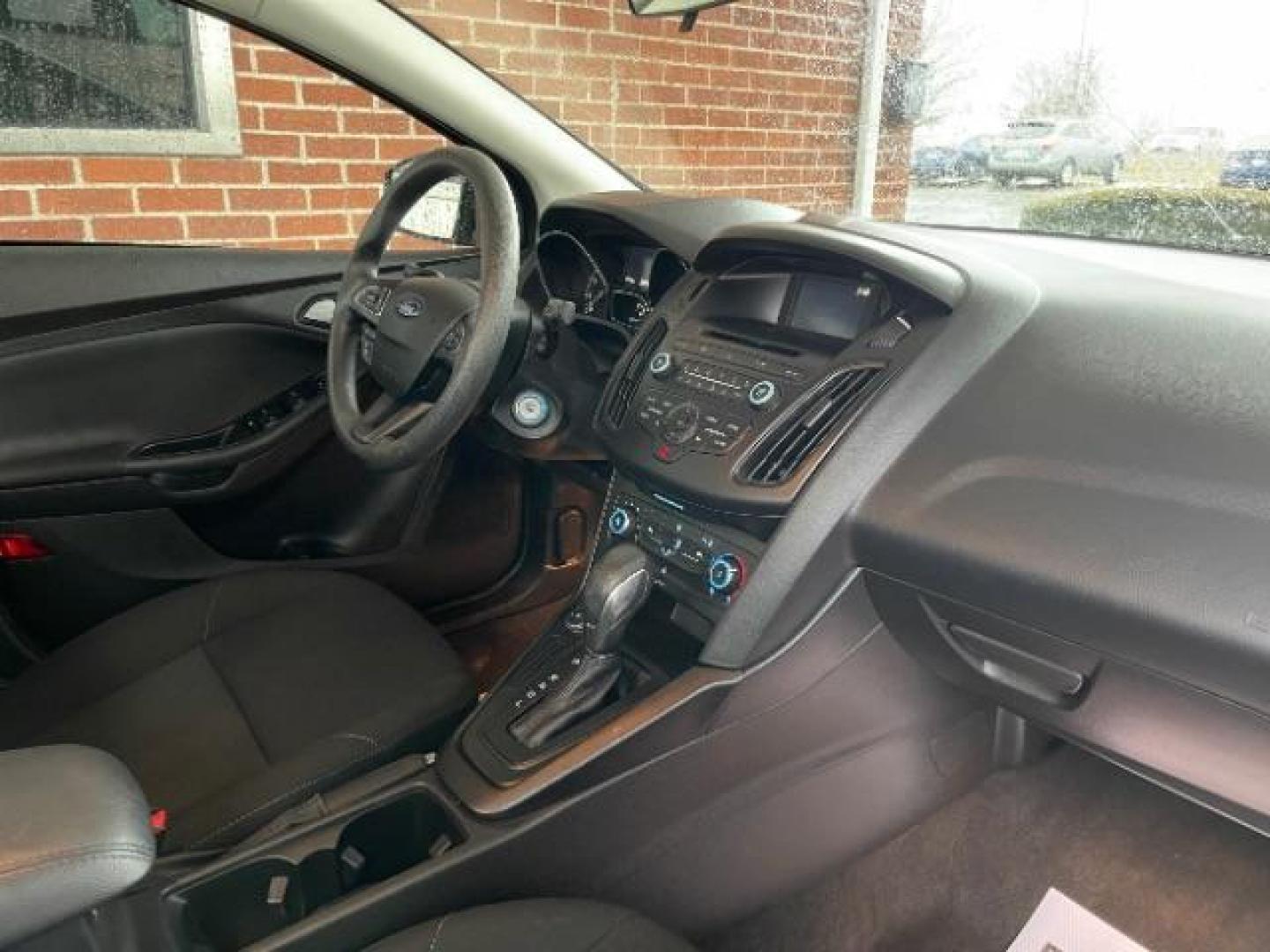 2017 Shadow Black Ford Focus SE Sedan (1FADP3F23HL) with an 2.0L L4 DOHC 16V engine, located at 1099 N County Rd 25A , Troy, OH, 45373, (937) 908-9800, 40.057079, -84.212883 - Photo#7