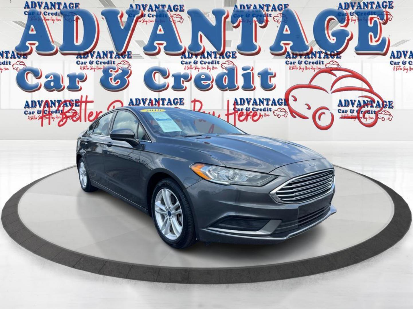 2018 Magnetic Metallic Ford Fusion SE (3FA6P0HD2JR) with an 1.5L L4 DOHC 16V engine, 6A transmission, located at 1184 Kauffman Ave, Fairborn, OH, 45324, (937) 908-9800, 39.807072, -84.030914 - Photo#0