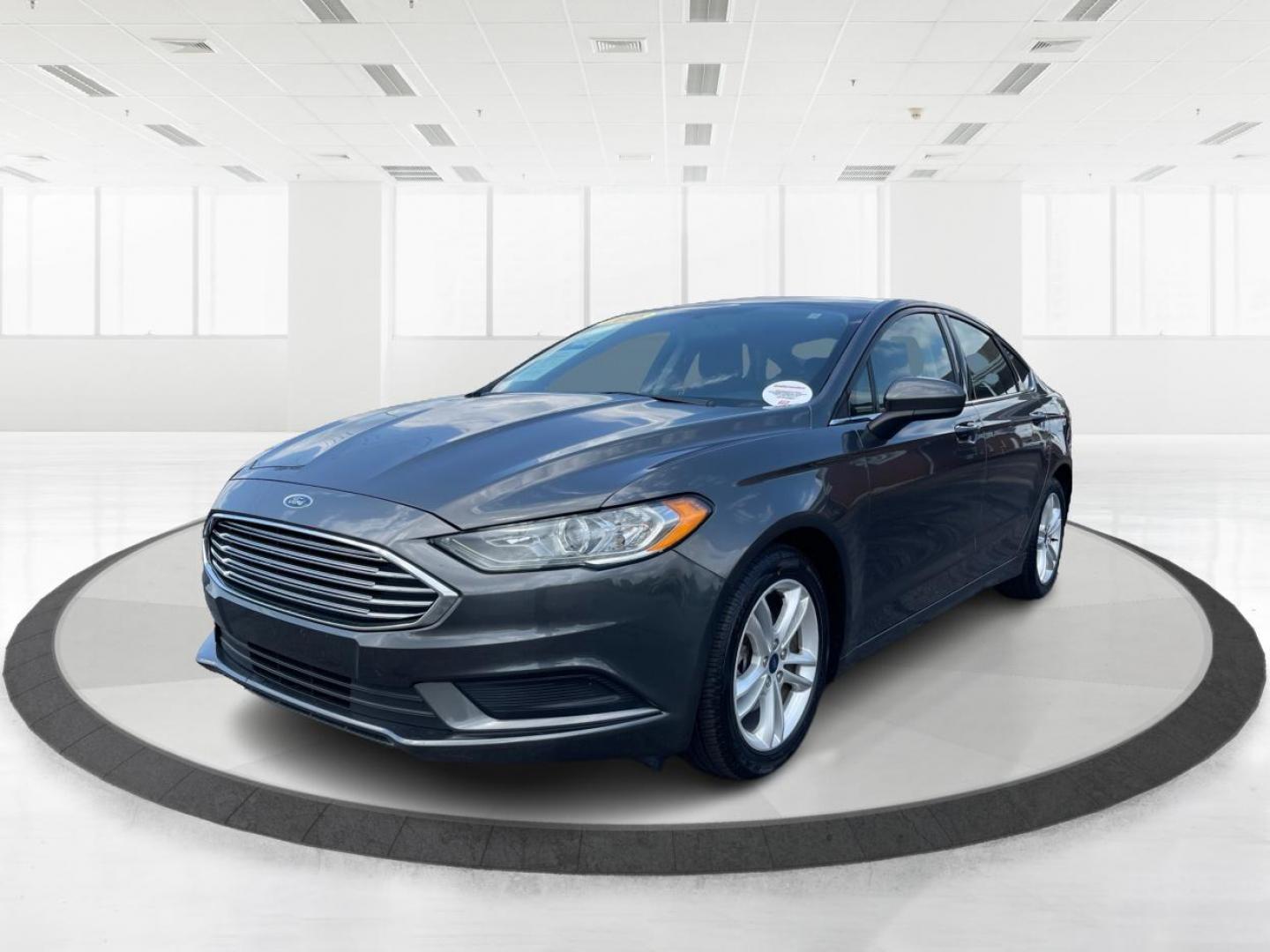 2018 Magnetic Metallic Ford Fusion SE (3FA6P0HD2JR) with an 1.5L L4 DOHC 16V engine, 6A transmission, located at 1099 N County Rd 25A , Troy, OH, 45373, (937) 908-9800, 40.057079, -84.212883 - Photo#7