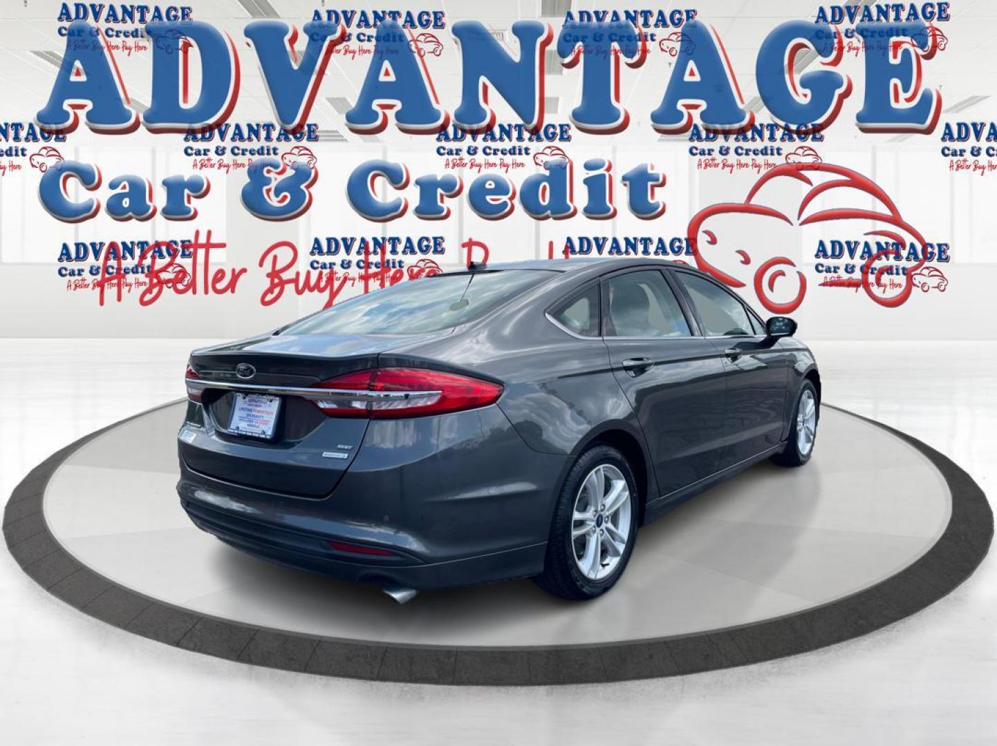 2018 Magnetic Metallic Ford Fusion SE (3FA6P0HD2JR) with an 1.5L L4 DOHC 16V engine, 6A transmission, located at 1184 Kauffman Ave, Fairborn, OH, 45324, (937) 908-9800, 39.807072, -84.030914 - Photo#2